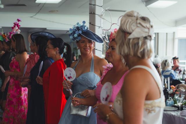 Guests chatting in millinery